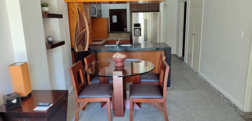 Stylish condo near pool and beach.