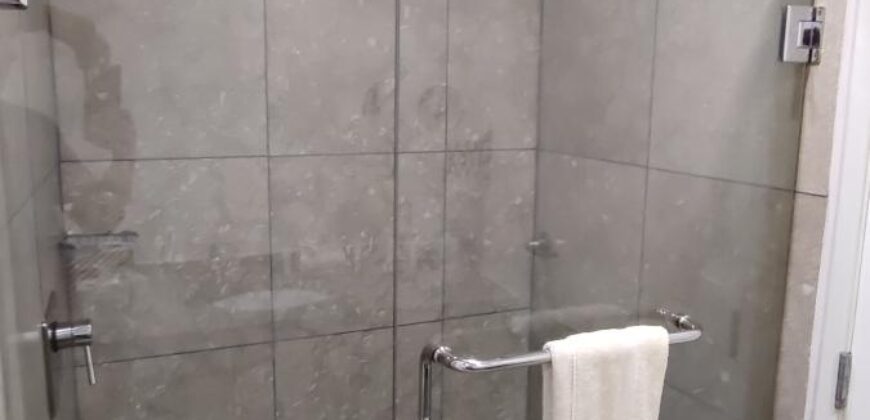 Stylish condo near pool and beach.