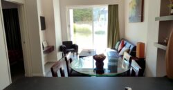 Stylish condo near pool and beach.