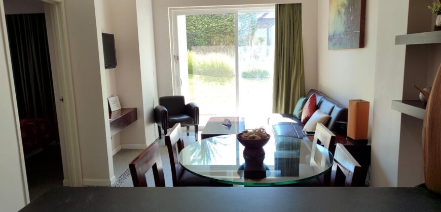 Stylish condo near pool and beach.