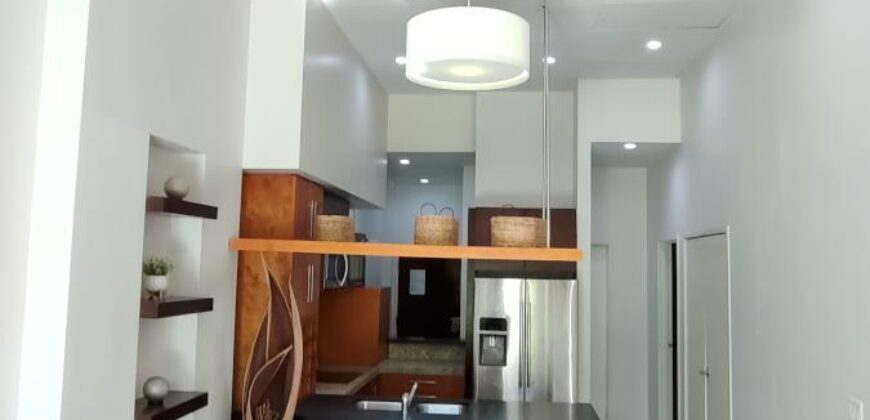 Stylish condo near pool and beach.