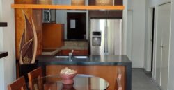 Stylish condo near pool and beach.