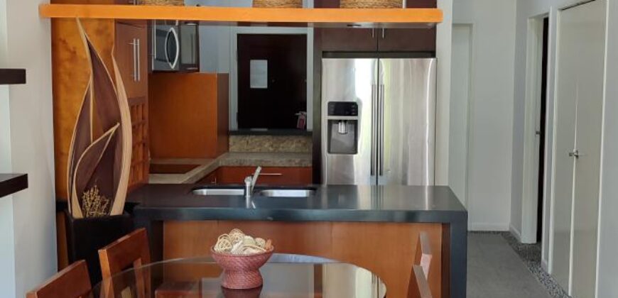 Stylish condo near pool and beach.